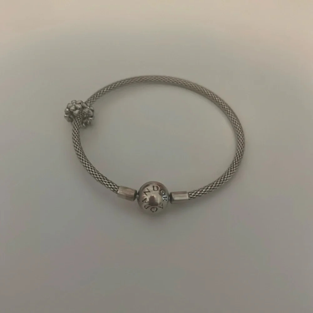 Pandora bracelet with a flower charm